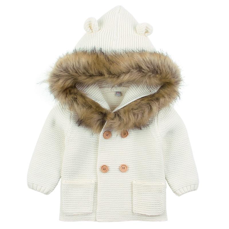 Stevvex ivory knit baby coat with fur-trimmed hood, brown buttons and front pockets on Tampa Home & Garden Store