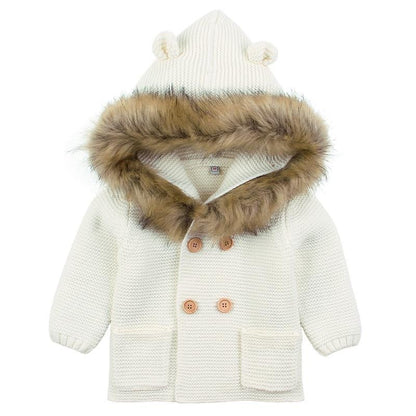 Stevvex ivory knit baby coat with fur-trimmed hood, brown buttons and front pockets on Tampa Home & Garden Store