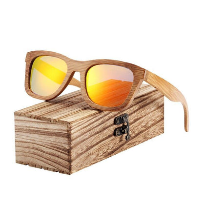 Bamboo wooden sunglasses with polarized orange UV400 lenses in natural frame on a wooden box on Tampa Home & Garden Store
