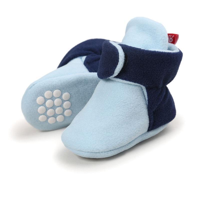 Baby booties pair by Stevvex in light blue and navy faux fleece with grip dots on Tampa Home & Garden Store