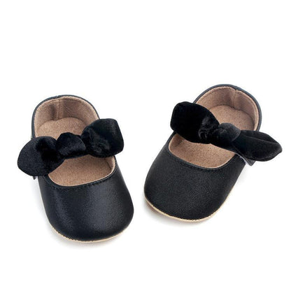 Pair of black baby shoes first walkers with bowknot for infant girls, soft rubber sole on Tampa Home & Garden Store
