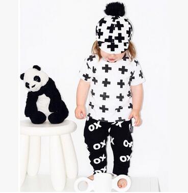 Stevvex baby boy apparel set white T-shirt with black plus pattern and black pants with print on Tampa Home & Garden Store