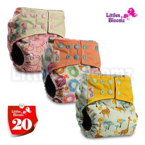 3-pack Stevvex cloth pocket nappies in pink floral, orange with blue snaps, yellow giraffe prints on Tampa Home & Garden Store