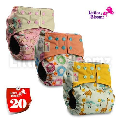3-pack Stevvex cloth pocket nappies in pink floral, orange with blue snaps, yellow giraffe prints on Tampa Home & Garden Store