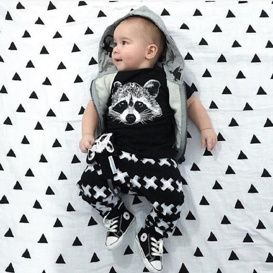 Baby boy T-shirt and pants set by Stevvex with raccoon graphic; black tee, X-pattern pants on Tampa Home & Garden Store