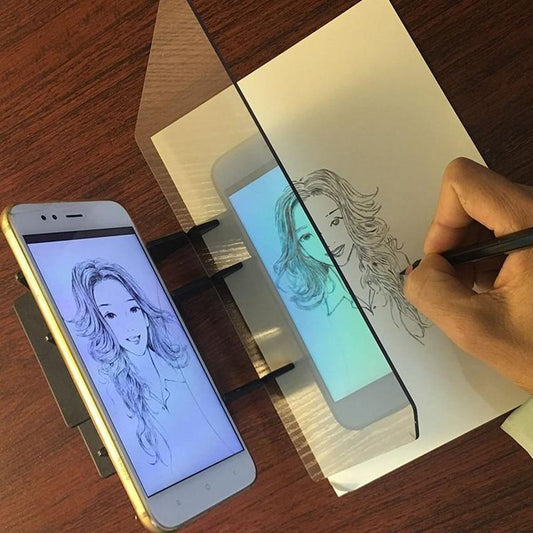 Stevvex kids LED projection drawing board toy drawing tablet with tracing sheet on table on Tampa Home & Garden Store