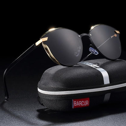 Stevvex round rimless sunglasses with gold accents and dark lenses on a BARCUR case on Tampa Home & Garden Store