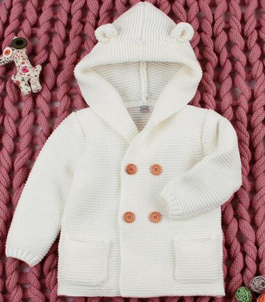 Stevvex white knit baby cardigan with hood, brown buttons and front pockets for newborns on Tampa Home & Garden Store