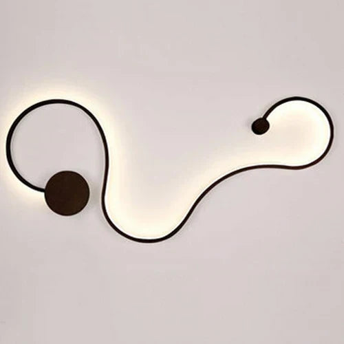 DecorBites LED aluminum wall lamp with flowing black wave design and round end caps, warm light on Tampa Home & Garden Store