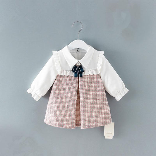 Stevvex baby dress with white top, pink plaid A-line skirt, lantern sleeves and navy bow on Tampa Home & Garden Store
