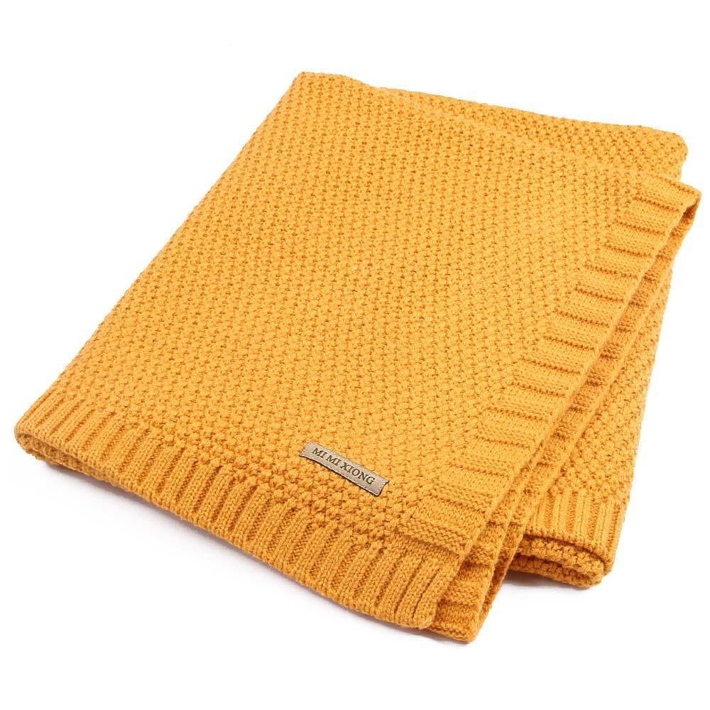 Knitted baby swaddle blanket in mustard yellow with ribbed border for newborns on Tampa Home & Garden Store