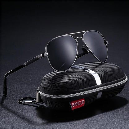 Stevvex polarized aviator sunglasses with black metal frame and dark lenses UV400 protection beside case on Tampa Home & Garden Store