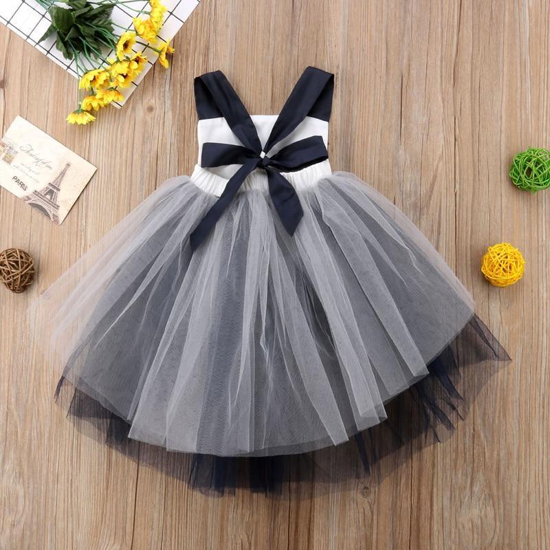 Infant girl Halloween dress by Stevvex with white bodice, black bow, gray tulle skirt on Tampa Home & Garden Store