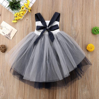 Infant girl Halloween dress by Stevvex with white bodice, black bow, gray tulle skirt on Tampa Home & Garden Store