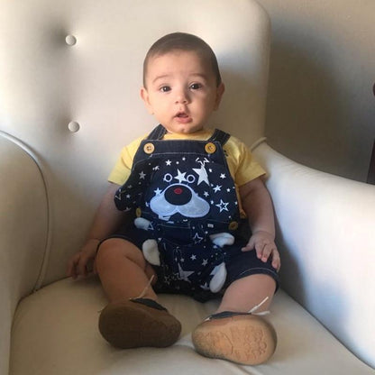 Stevvex baby denim overalls with star pattern, navy with yellow straps worn by a toddler on Tampa Home & Garden Store