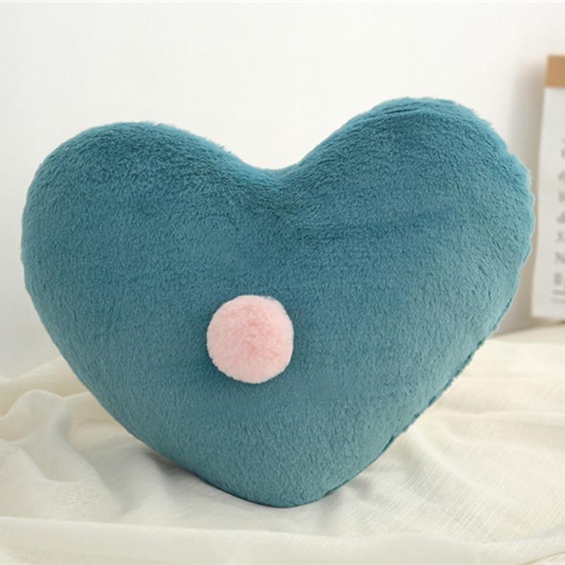 Heart-shaped nursing pillow plush in teal with pink pompom for newborns Stevvex baby decor on Tampa Home & Garden Store