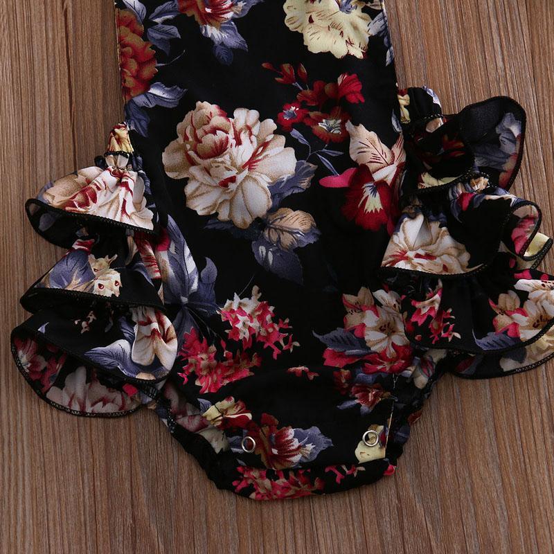 Floral baby romper set by Stevvex with sleeveless jumpsuit and headband, black blooms on Tampa Home & Garden Store