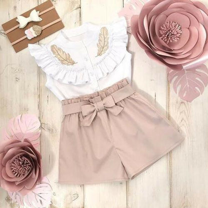 Stevvex baby girl two-piece: white ruffled top with gold leaf accents and beige bow shorts on Tampa Home & Garden Store