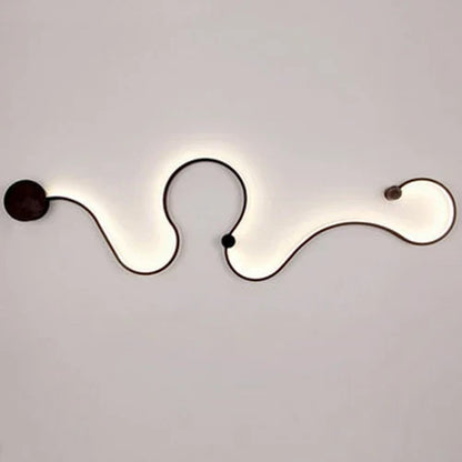DecorBites LED Aluminum Wall Lamps, black aluminum wall light with soft backlit wavy design on Tampa Home & Garden Store
