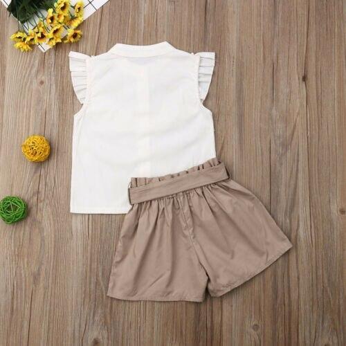 Stevvex baby girl two-piece outfit: white sleeveless top with ruffled shoulders and tan shorts on Tampa Home & Garden Store