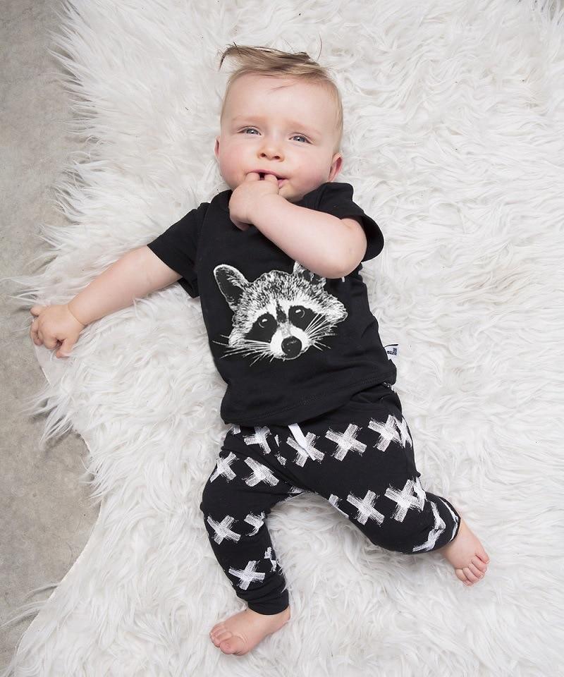 Baby boy 2pc Stevvex set: black tee with raccoon print and pants with white X patterns on Tampa Home & Garden Store