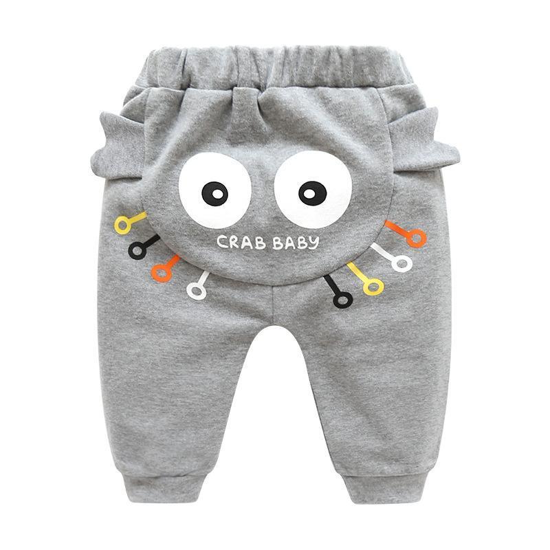 Grey baby pants with back crab face, big white eyes and colorful line accents on Tampa Home & Garden Store