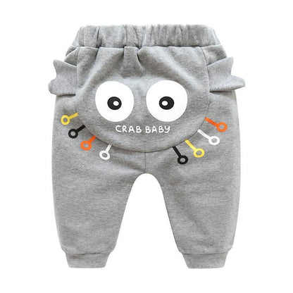 Grey baby pants with back crab face, big white eyes and colorful line accents on Tampa Home & Garden Store