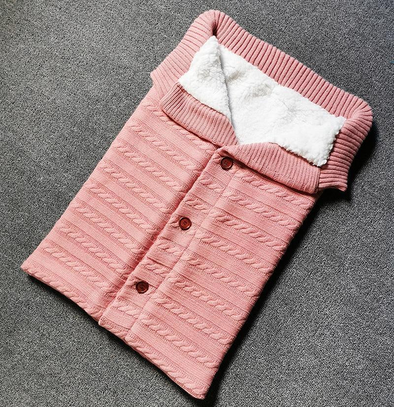 Stevvex pink knitted baby swaddling blanket with white sherpa lining and button-front design on Tampa Home & Garden Store