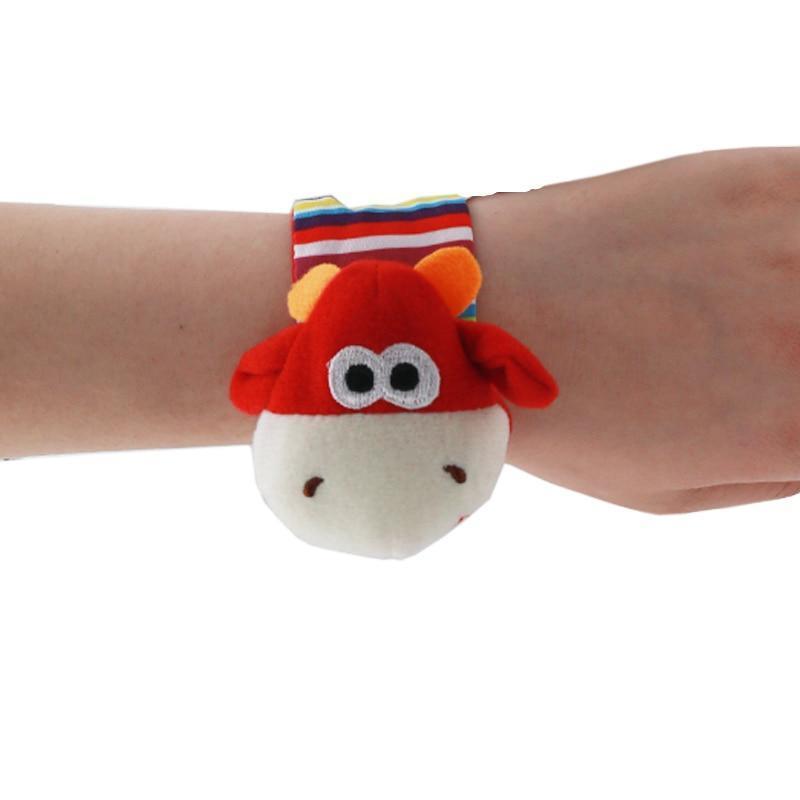 Stevvex wrist rattle plush cow toy with red head, white face and striped strap for babies on Tampa Home & Garden Store