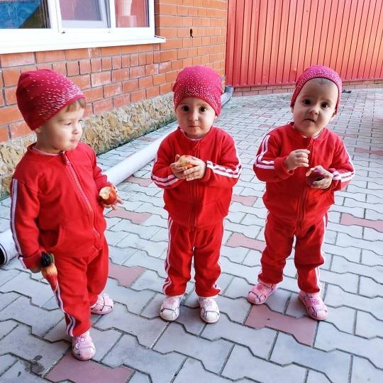 Stevvex 2pc baby clothing set red cotton zip jacket and pants sport design worn by three babies on Tampa Home & Garden Store