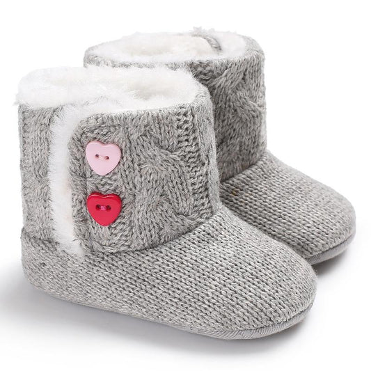 Stevvex gray knitted baby boots pair with plush white lining and pink heart buttons on Tampa Home & Garden Store