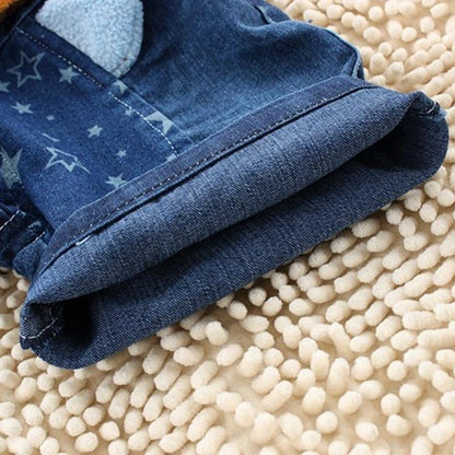 Denim baby romper with star-print panel and rolled cuffs on dark indigo fabric on Tampa Home & Garden Store