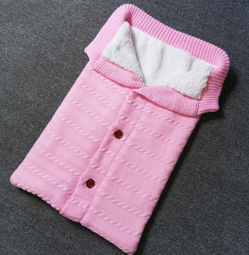 Stevvex pink knitted baby swaddle blanket with white sherpa lining and button front on Tampa Home & Garden Store