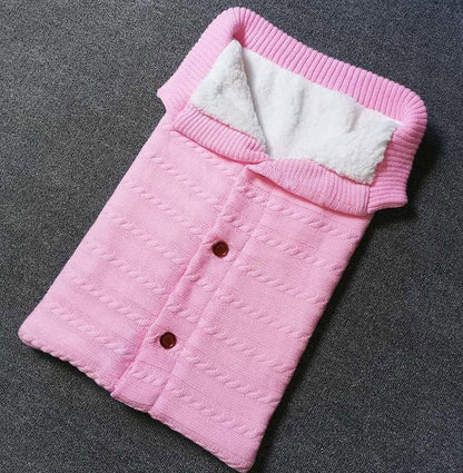 Stevvex pink knitted baby swaddle blanket with white sherpa lining and button front on Tampa Home & Garden Store