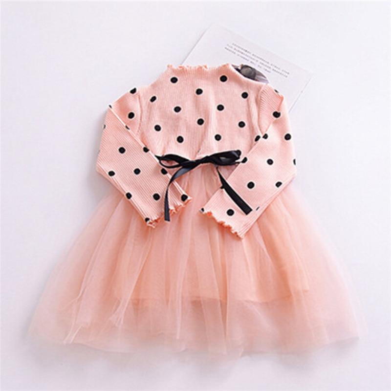 Polka dot long-sleeve baby dress with peach tulle skirt and black ribbon belt by Stevvex on Tampa Home & Garden Store
