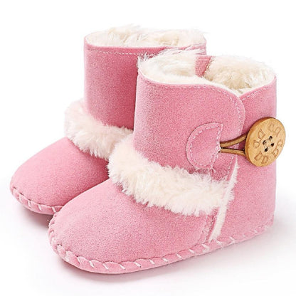 Stevvex pink suede newborn baby boots with white faux fur trim and wooden toggle for first steps on Tampa Home & Garden Store