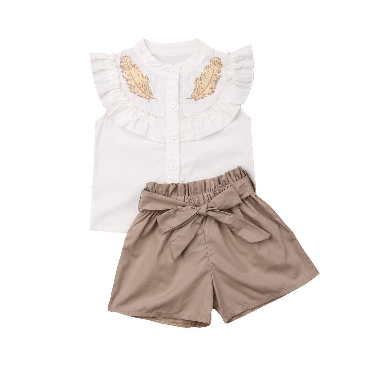 Baby girl outfit: white top with ruffle collar and beige feather print + taupe shorts on Tampa Home & Garden Store