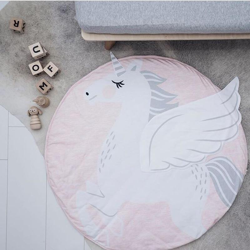 Round pink unicorn baby play mat with white wings and plush texture on Tampa Home & Garden Store