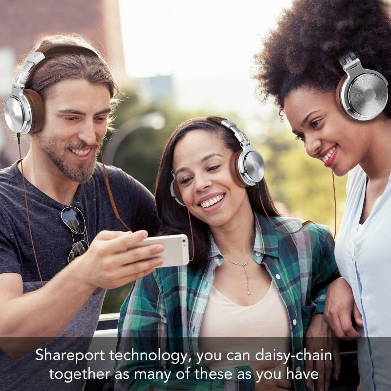 Stevvex DJ headphones with wired mic and silver cups; three people wearing them outdoors on Tampa Home & Garden Store
