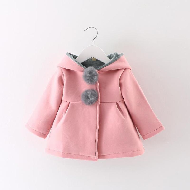 Newborn girls pink coat with gray faux fur pom-poms and hooded gray lining on Tampa Home & Garden Store