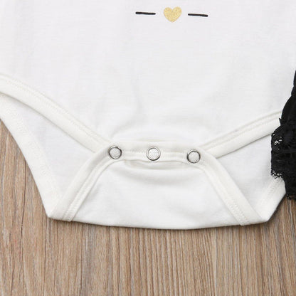 Stevvex white baby bodysuit with bottom snap closures, gold heart print, black lace trim on Tampa Home & Garden Store