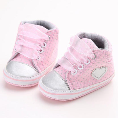 Infant girl pink dotted lace-up first walkers sneakers with silver toe caps and heart patch pair on Tampa Home & Garden Store