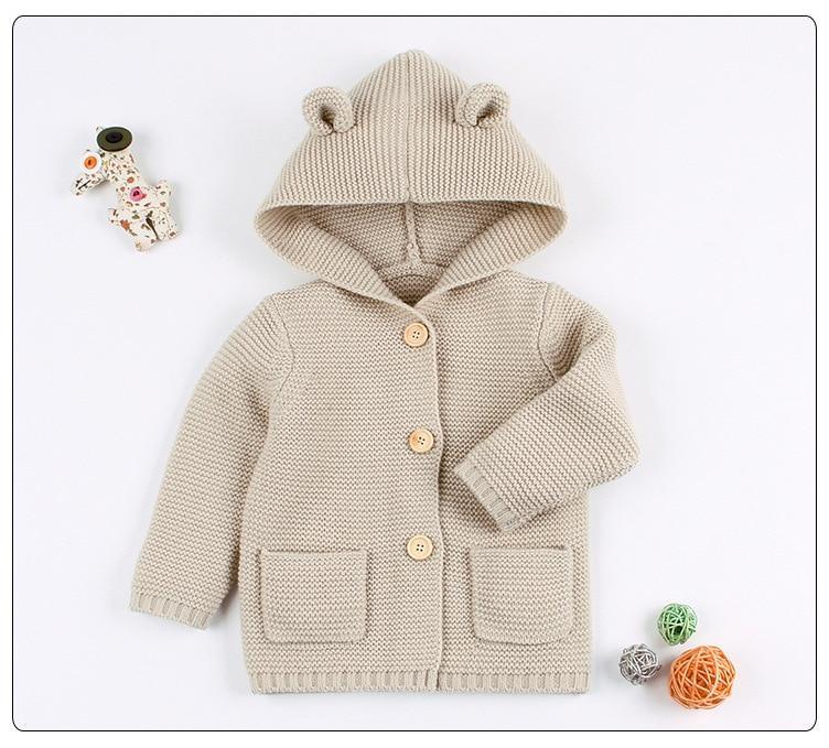 Newborn knitted hooded cardigan in beige with bear ears, front pockets and wooden buttons on Tampa Home & Garden Store