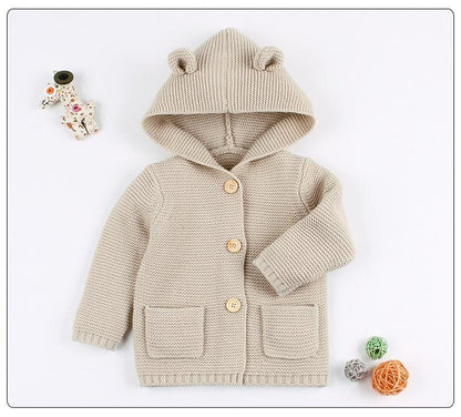 Newborn knitted hooded cardigan in beige with bear ears, front pockets and wooden buttons on Tampa Home & Garden Store