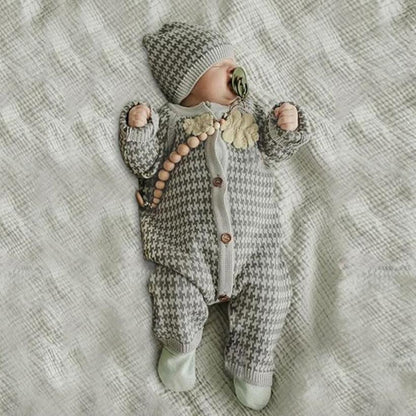 Knitted newborn romper with plaid hat by Stevvex; gray houndstooth jumpsuit with wooden buttons on Tampa Home & Garden Store