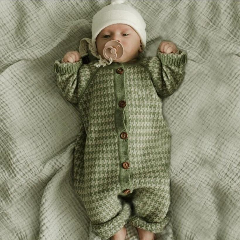 Knitted newborn cotton romper in green houndstooth, button-front, footed with white hat on Tampa Home & Garden Store
