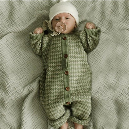 Knitted newborn cotton romper in green houndstooth, button-front, footed with white hat on Tampa Home & Garden Store