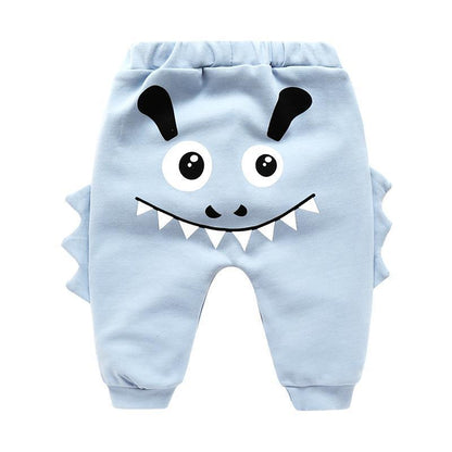 Stevvex light blue baby pants with cartoon monster face, big eyes, toothy grin, side fins on Tampa Home & Garden Store