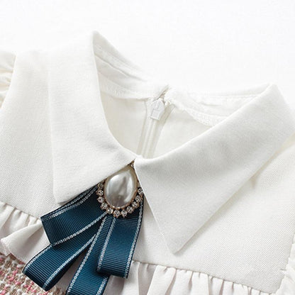 Stevvex baby dress collar detail with navy blue grosgrain bow and pearl rhinestone brooch on Tampa Home & Garden Store