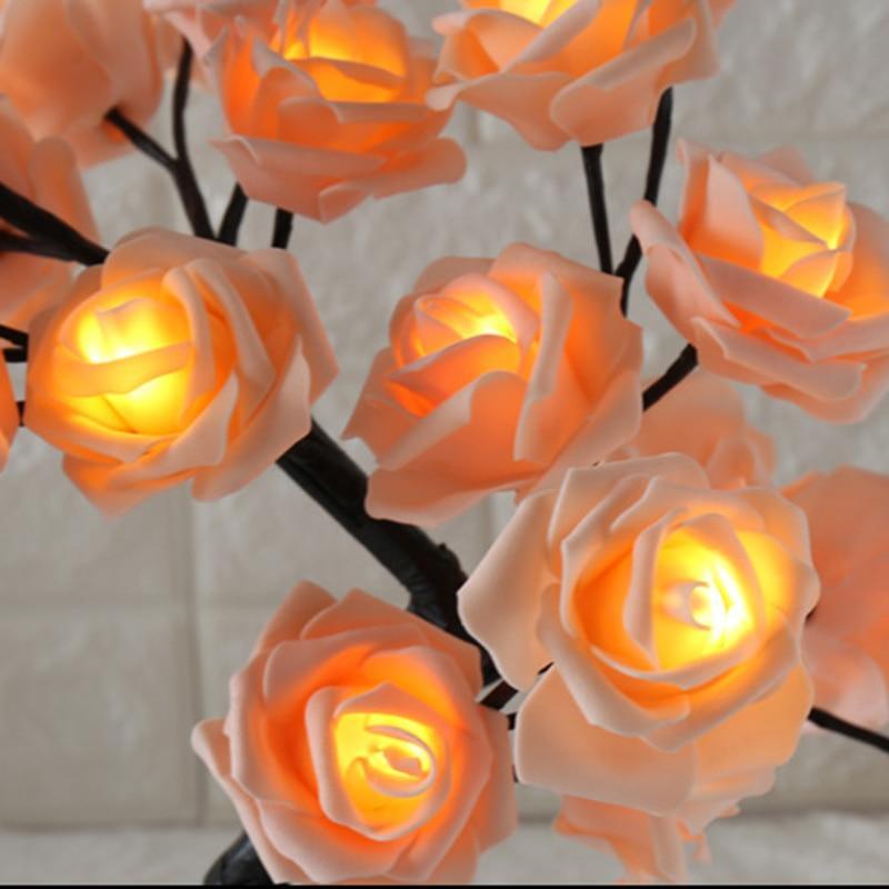 Stevvex rose-shaped table lamp with peach petals and warm amber LEDs on black branch stems on Tampa Home & Garden Store